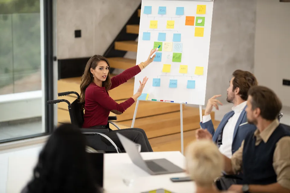 A founder presenting to her team