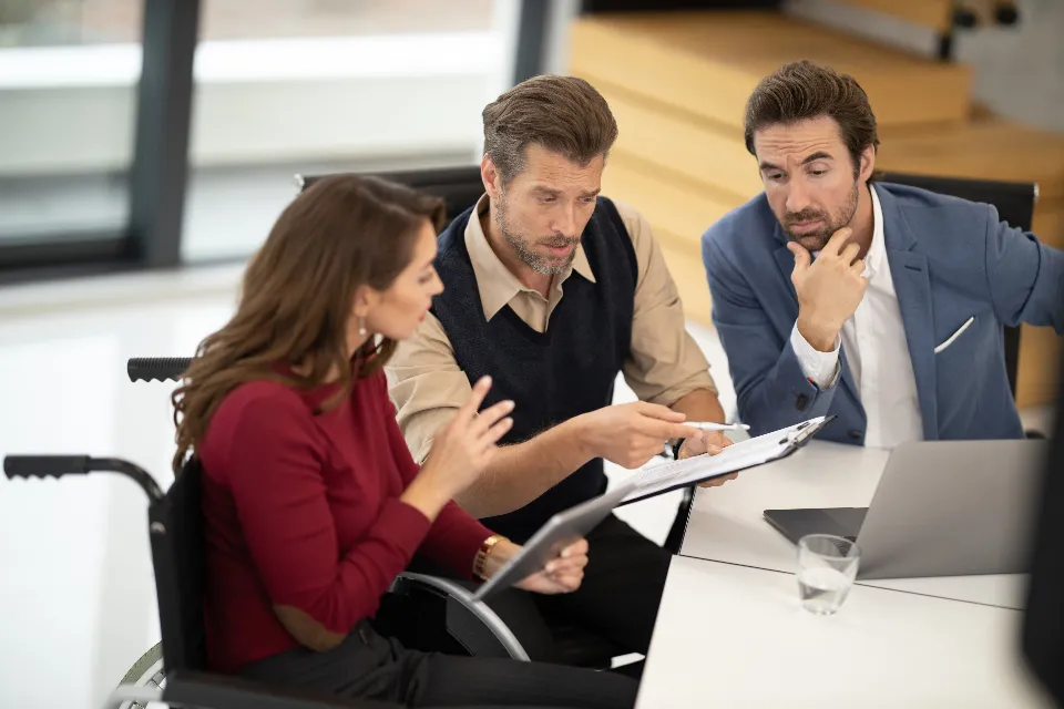 A mixed team reviewing work together